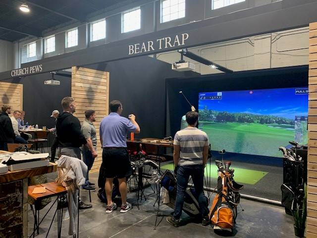 Dudes golfing together.